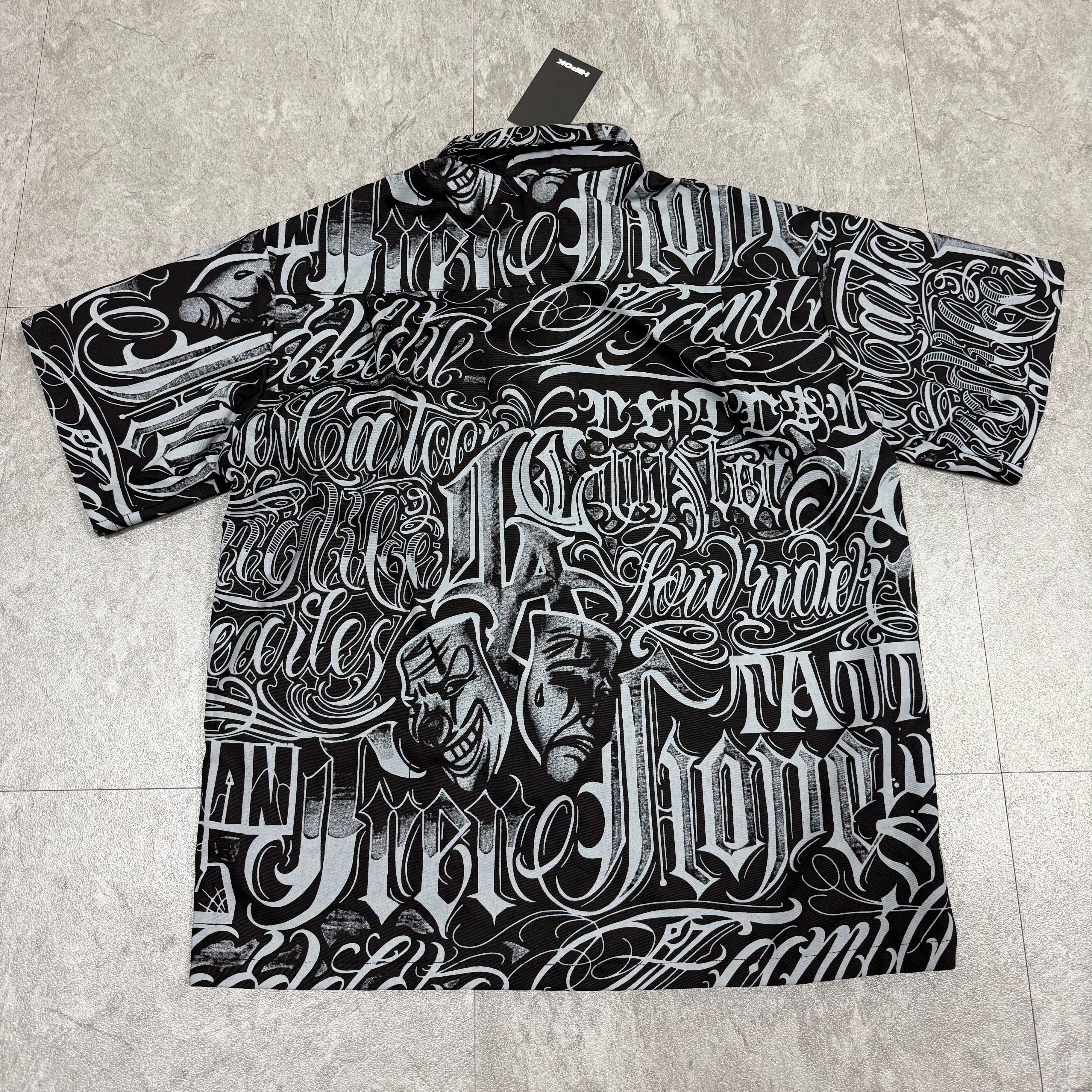 Chicano shirt back fully laid out on floor