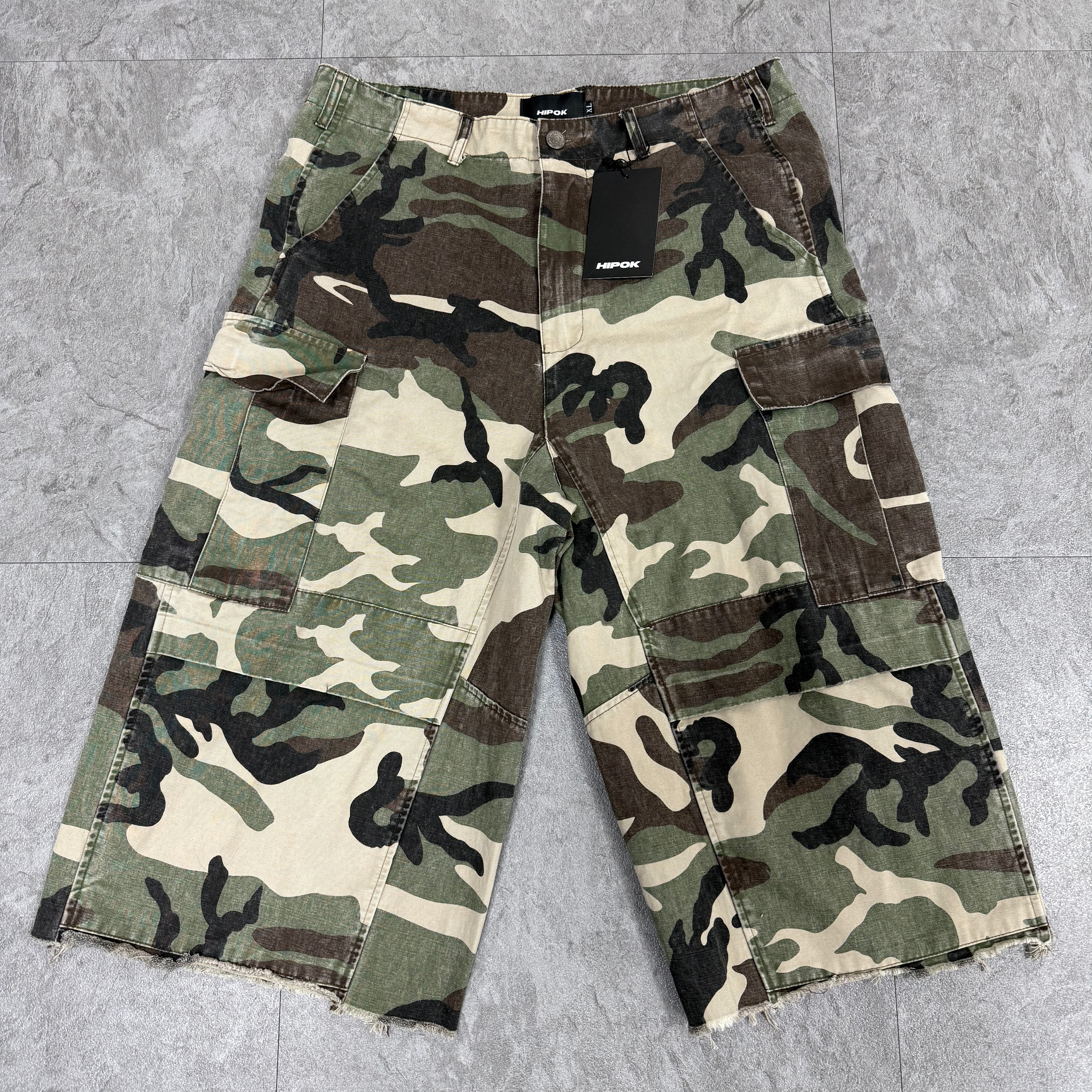 Front view of Camouflage Premium Shorts laid flat on the floor