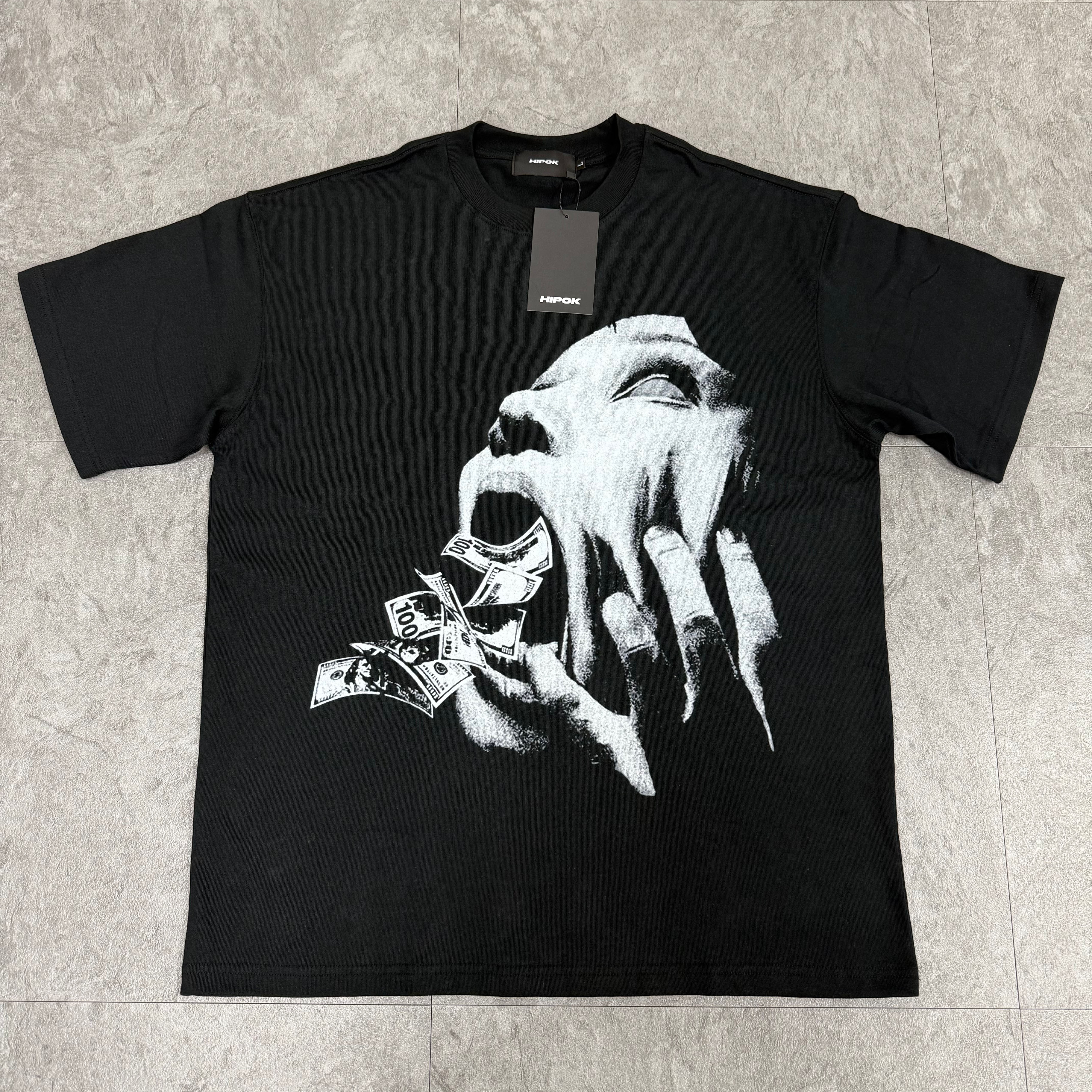 Front view of Money Stress black T-shirt laid flat on the floor